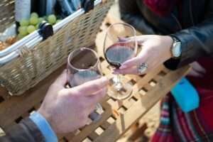 People Holding Wine Glasses Doing a Toast